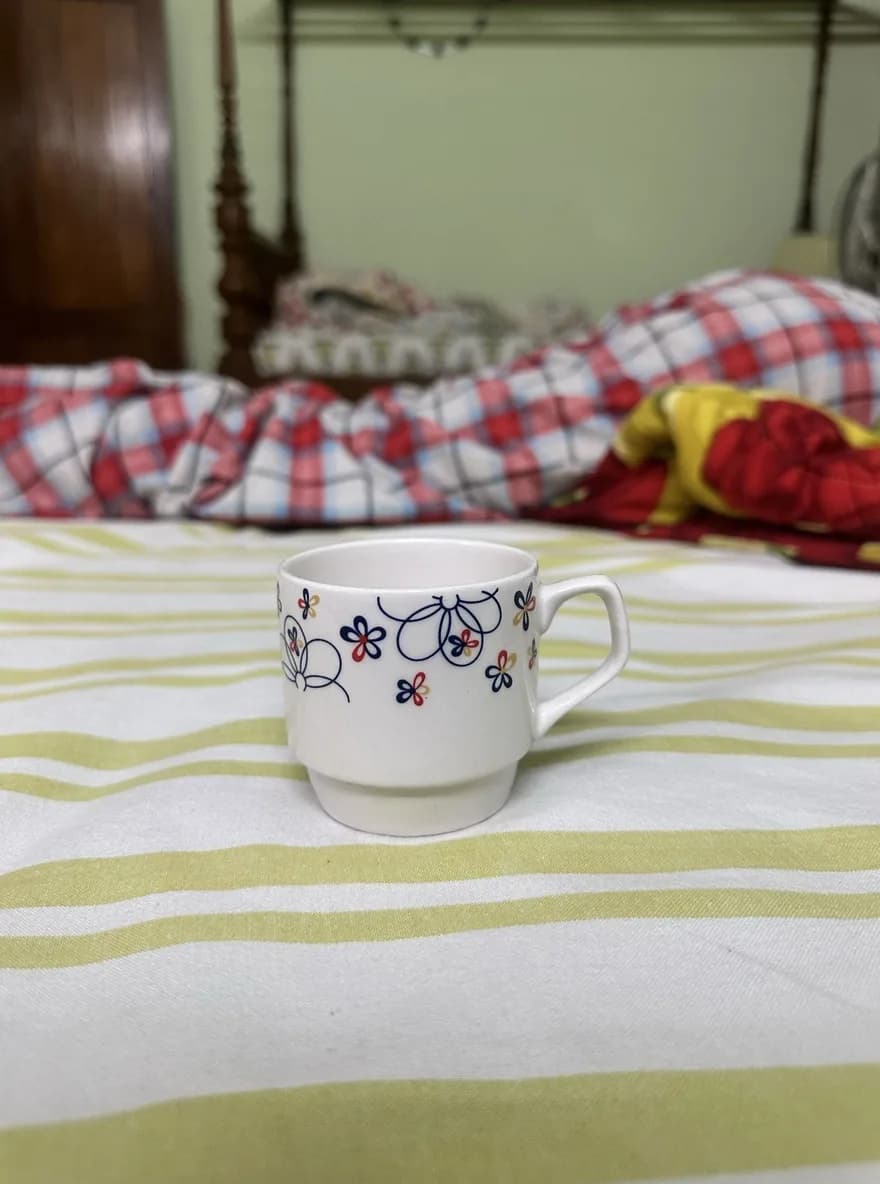 The original phone photo of a ceramic mug